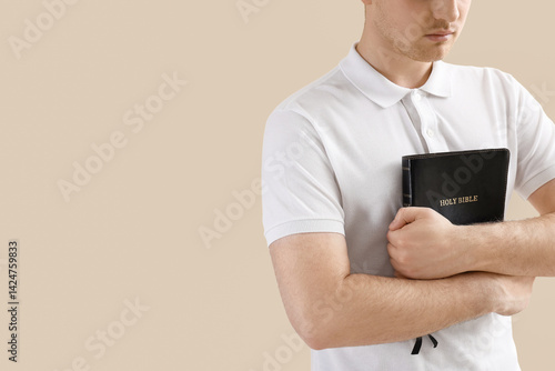 Young man with Holy Bible p...