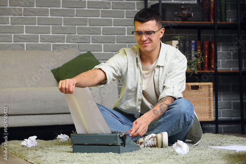 Displeased male author with...