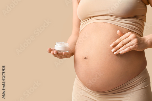 Pregnant woman holding jar ...