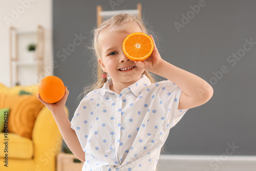 Cute little girl with orang...