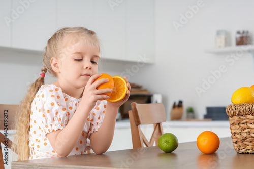 Cute little girl with orang...