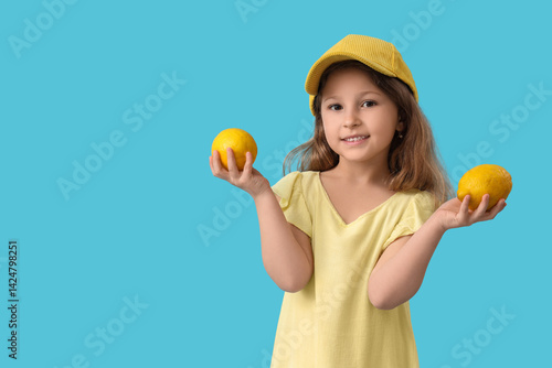 Cute little girl with lemon...