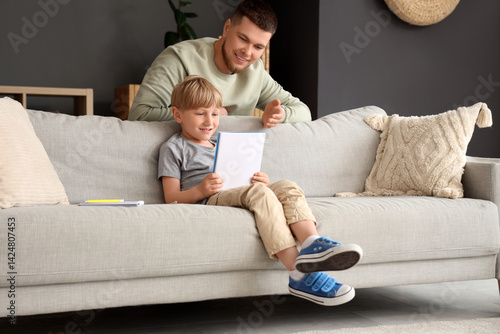 Young father explaining hom...
