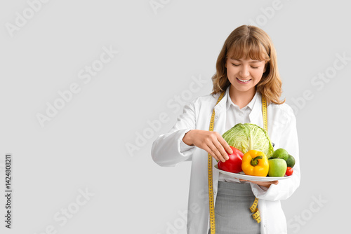 Young happy female nutritio...
