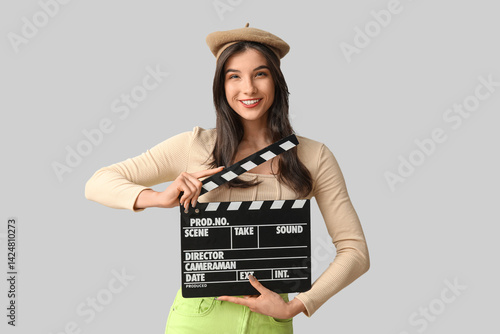 Young happy woman with movi...
