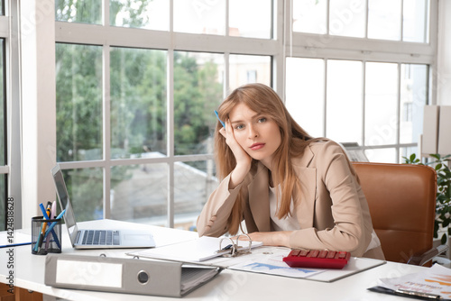 Young businesswoman working...