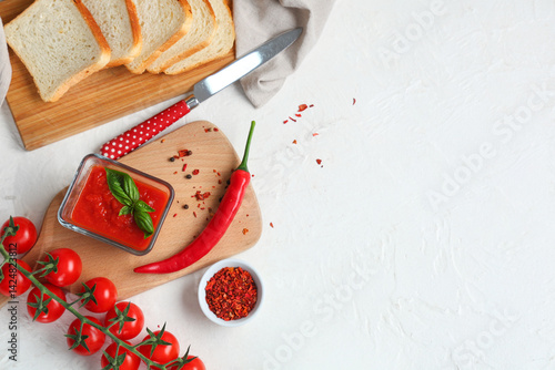Glass bowl of tomato sauce ...