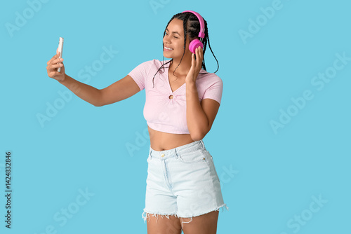 Young woman with pink headp...