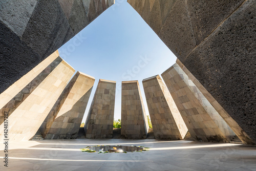 Yerevan, Yerevan Province, Armenia. The eternal flame with flowers, in the Memorial Hall at the Tsitsernakaberd Armenian Genocide Memorial Complex.