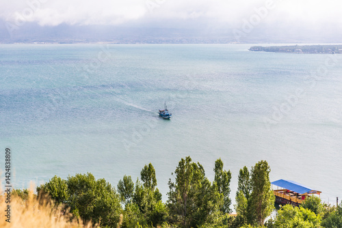 Obraz na płótnie Western Asia, Eurasia, South Caucasus, Republic of Armenia. Sevan. View of tourist boat on Lake Sevan from the Sevanavank Monastery complex. w salonie