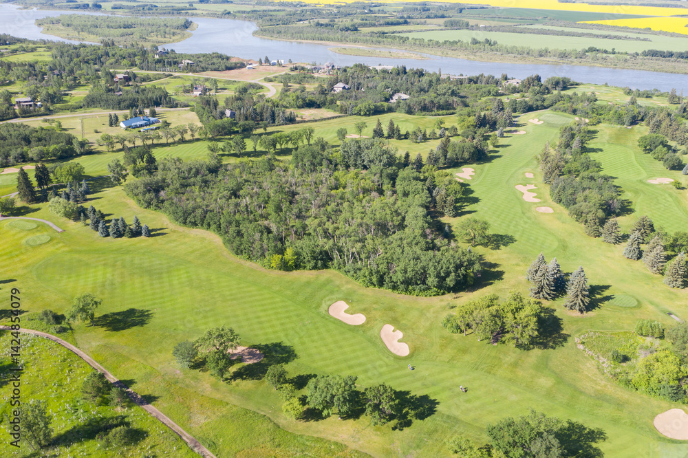 Golf course with a lake in the background Golf course with a lake in the background