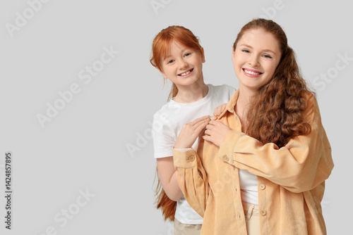 Young ginger woman and her ...