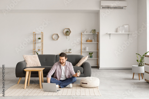 Young man with air conditio...