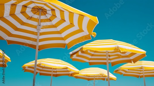 Fototapeta Naklejka Na Ścianę i Meble -  yellow beach umbrella and chairs
