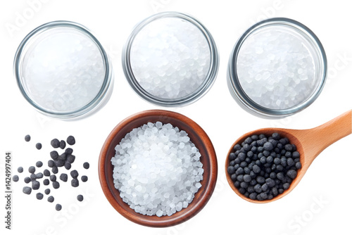 Salt Crystal Texture Top View with Bowls and Wooden Spoon on Black Isolated Background