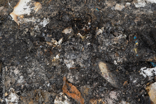 фотографія Abstract texture of charred and ashen remains after a fire incident
