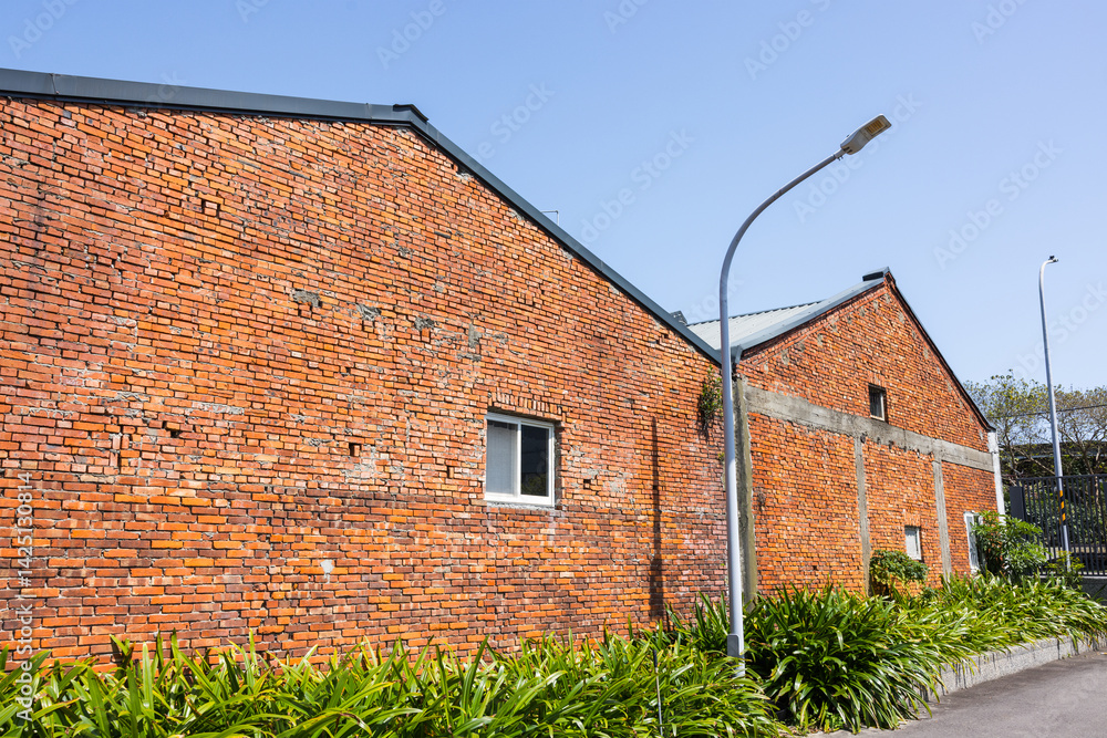 Red brick warehouse building at outdoor location