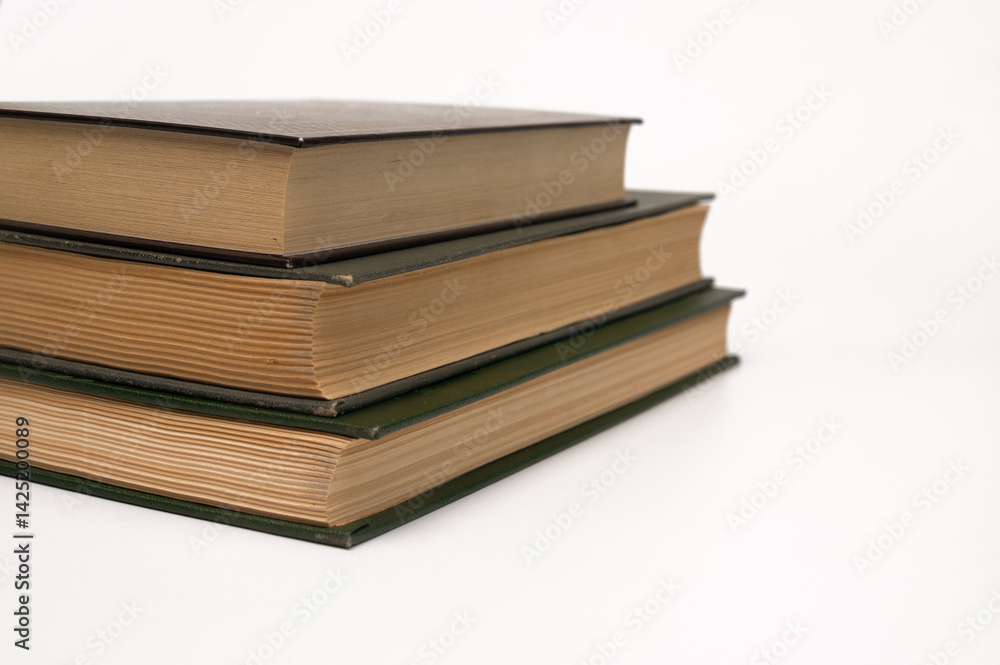 a stack of three books on a white background. concept a stack of three books on a white background. concept