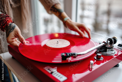 Obraz na płótnie Woman putting red vinyl record on record player w salonie