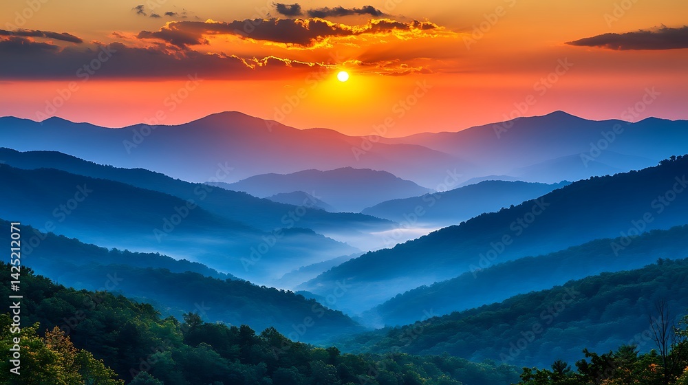 Obraz premium Colorful Sunrise Over Misty Mountain Ranges