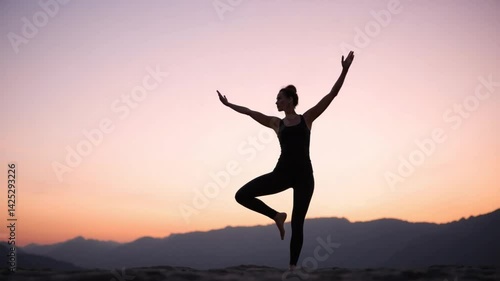 Wallpaper Mural Silhouette of graceful woman practicing yoga at sunset. Balance and harmony Torontodigital.ca