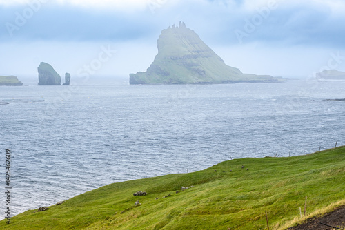 Beautiful landscape with  Sorvagsfjord in Vagar island on Faroe Islands, Skelhormur island in the background