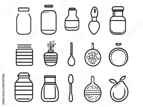 Golden clarified butter in glass jar with spoon