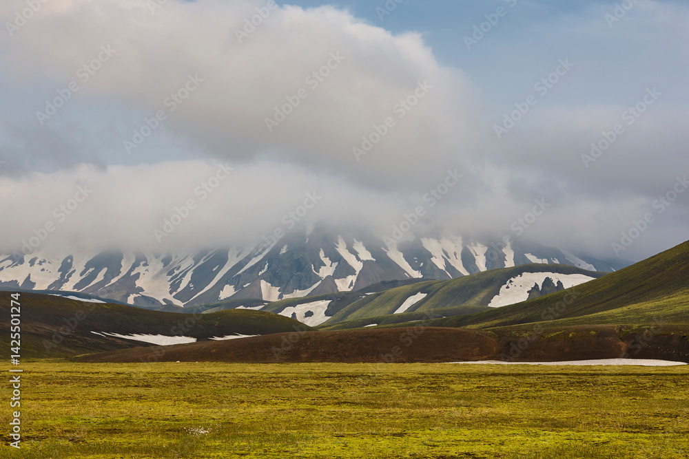 Green mountain landscape with snow. Fjallabak. South area. Iceland