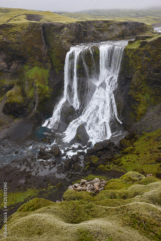 Fagrifoss waterfall. Mossy rocky landscape in Lakagigar. South area. Iceland