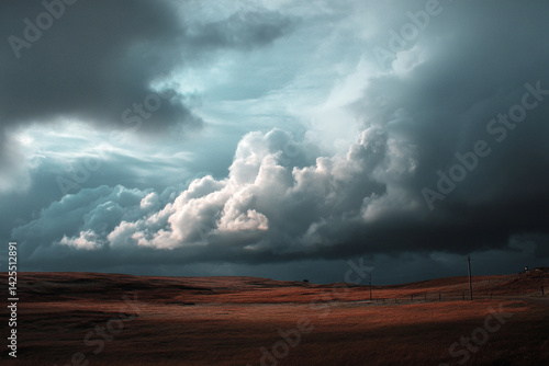 Wallpaper Mural Dark storm clouds loom ominously over an expansive landscape as the day transitions into evening, creating a moody atmosphere Torontodigital.ca