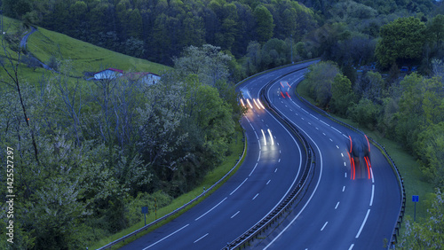 Obraz na płótnie Transport trucks travel along the highway carrying goods to different destinations in the Basque Country. w salonie