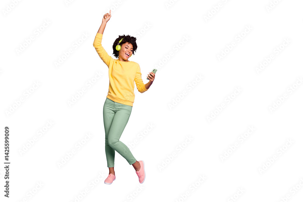 Full length body size photo of curly wavy trendy sweet cute carefree girl dancing and singing while reading song text on her telephone and wearing headphones isolated violet pastel color background Full length body size photo of curly wavy trendy sweet cute carefree girl dancing and singing while reading song text on her telephone and wearing headphones isolated violet pastel color background