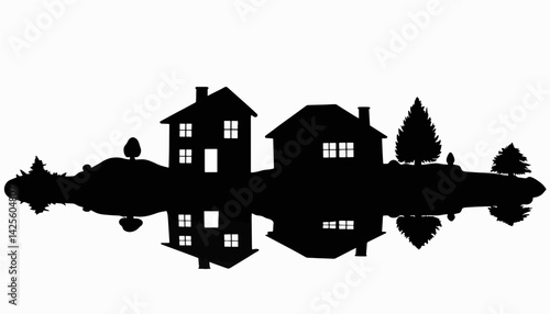 Silhouette of residential homes reflecting on water, real estate concept