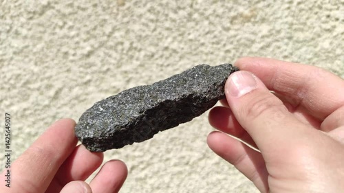 Geodesy. Mineral. Granite. Science and study. Natural minerals in hands. Mining. Mineral miners. Mineralogy. Natural resources.