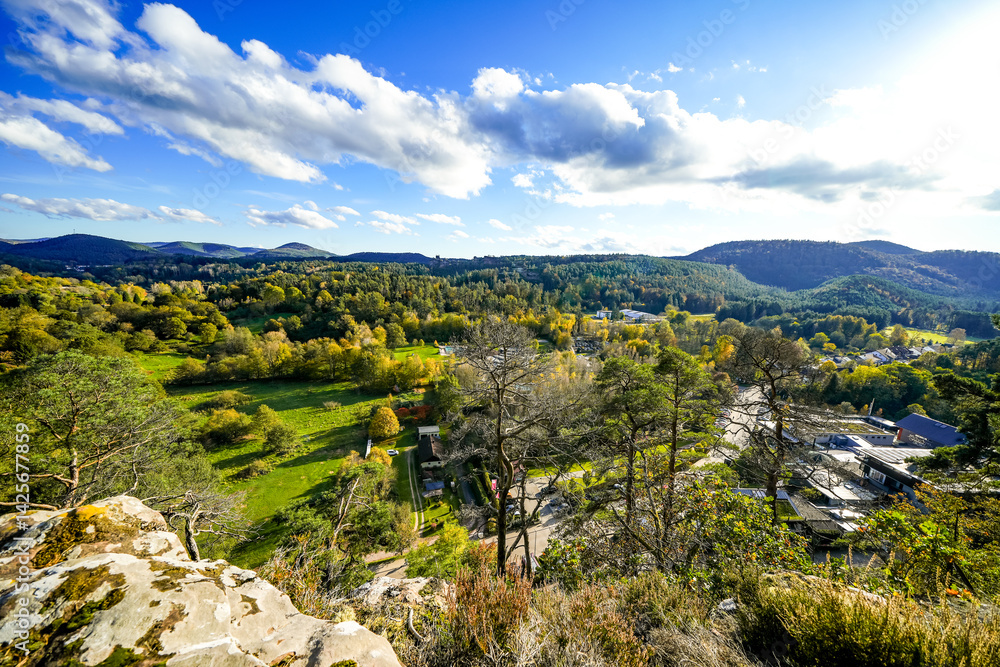 Obraz premium View of the surrounding landscape from the Pfaffenfelsen near Dahn. Nature with hills and forests in the Palatinate region. Lookout rock with panoramic views. 