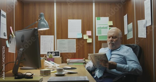 Inefficient employee doing a crossword puzzle instead of working