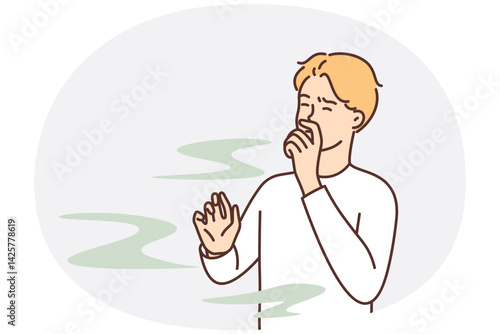 Man covers nose so as not to smell unpleasant smell from harmful production