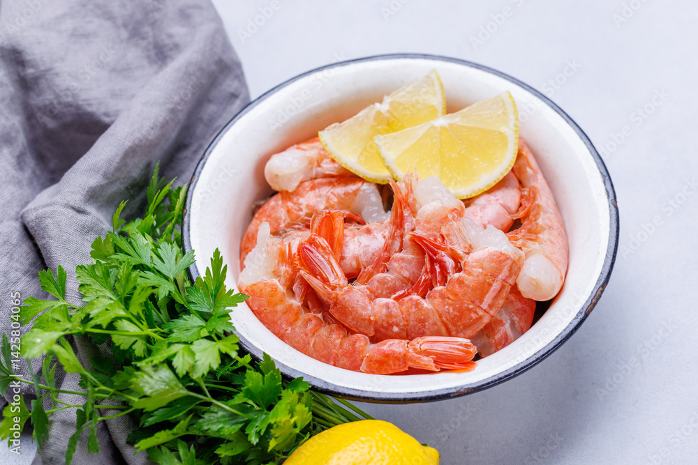 Fresh shrimps, accompanied by sprigs of fresh parsley and juicy lemon Fresh shrimps, accompanied by sprigs of fresh parsley and juicy lemon