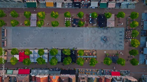 Wallpaper Mural 4K drone footage of Koemarkt in Purmerend, Noord-Holland, typical Dutch market square at golden hour, close to Amsterdam and Zaandam, bustling with cafes and local life Torontodigital.ca