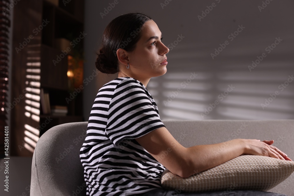 Obraz premium Depressed young woman on sofa at home