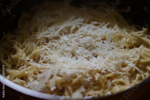 Spaghetti carbonara with parmesan cheese.