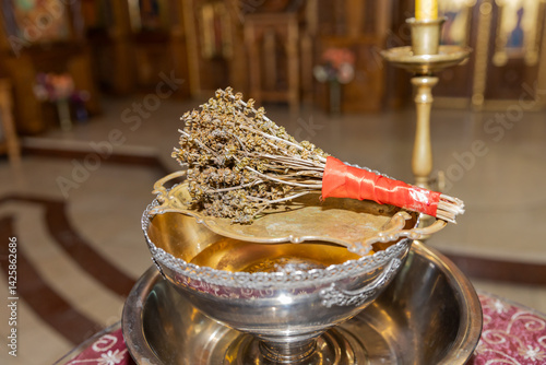 Orthodox Ritual Items: Dried Herbs, Holy Water, and Silver Bowl