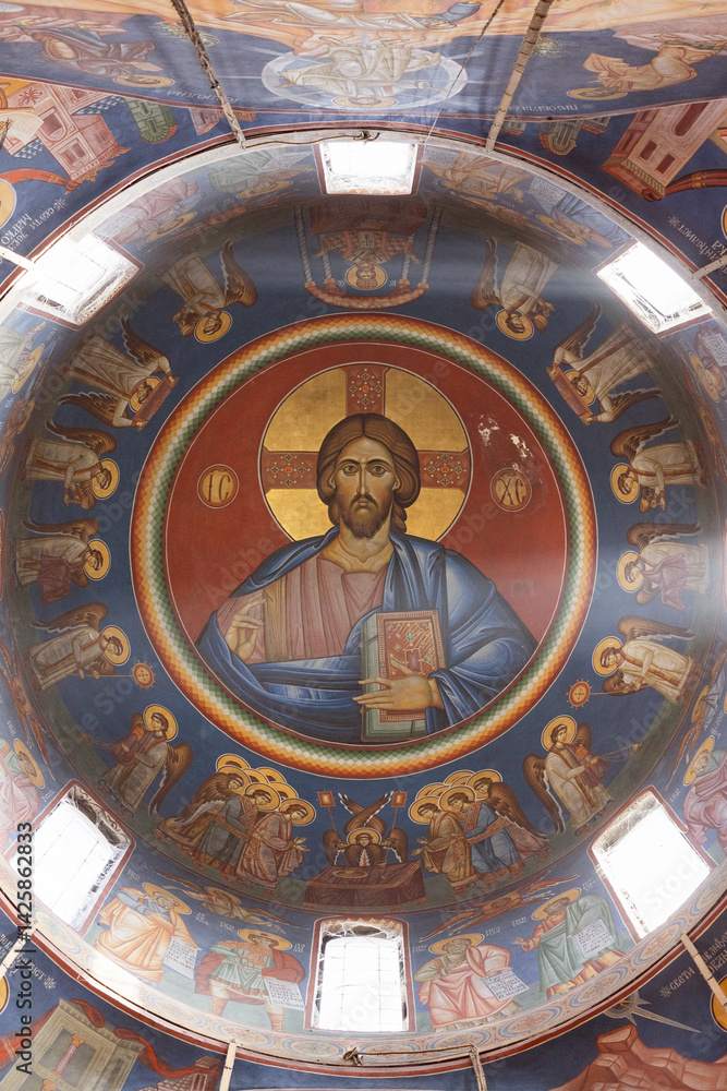 Obraz premium Ornate Church Dome with Religious Frescoes and Central Jesus Image