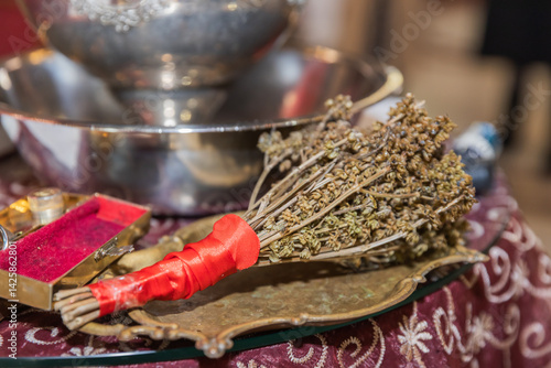 Orthodox Ritual Items: Dried Herbs, Holy Water, and Silver Bowl