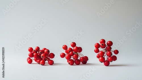 Bright red rowan berries clustered on a natural background