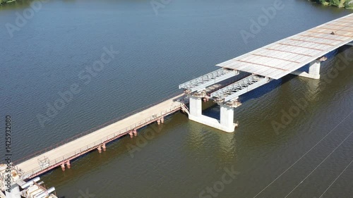 Construction of an automobile bridge across the river. View from above