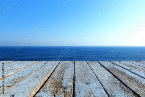 Calm ocean view from a wooden deck on a sunny day by the seaside