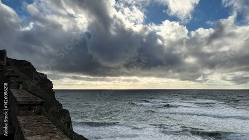Dramatic ocean view with stormy clouds, coastal serenity, nature beauty, seaside escape, perfect for Earth Day or meditation themes