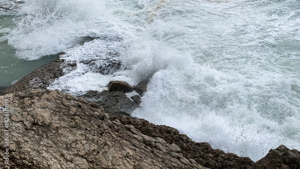 Crashing ocean waves on rocky shore, symbolizing power and nature, perfect for summer vacation or Earth Day themes Crashing ocean waves on rocky shore, symbolizing power and nature, perfect for summer vacation or Earth Day themes