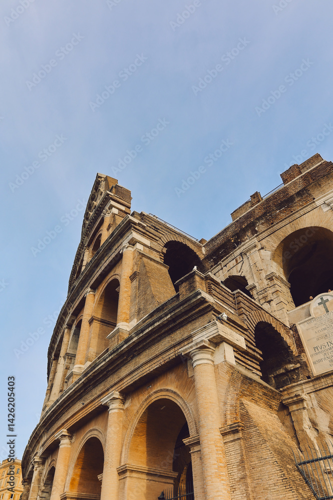 Fototapeta premium Panoramic view of old Colosseum in Rome. Beautiful popular of ancient landmark. Famous card of city of Rome, Italy